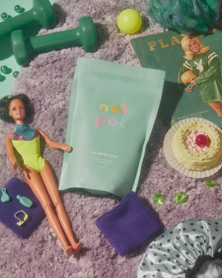 girl in yellow dress sitting on floor with pink book