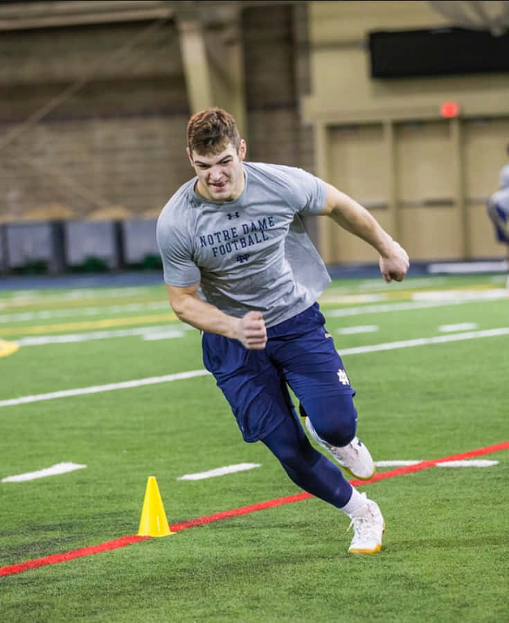 Jogador de Futebol Notre Dame em Treinamento