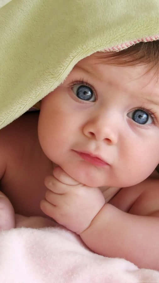 Ihrerstes Lächeln - Freude eines Babys