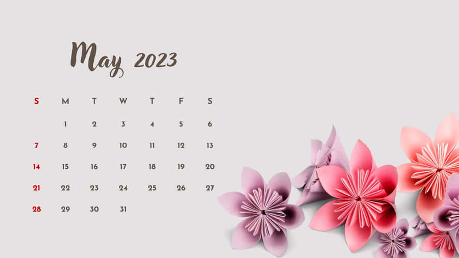 EinKalender mit pinken Blumen darauf.