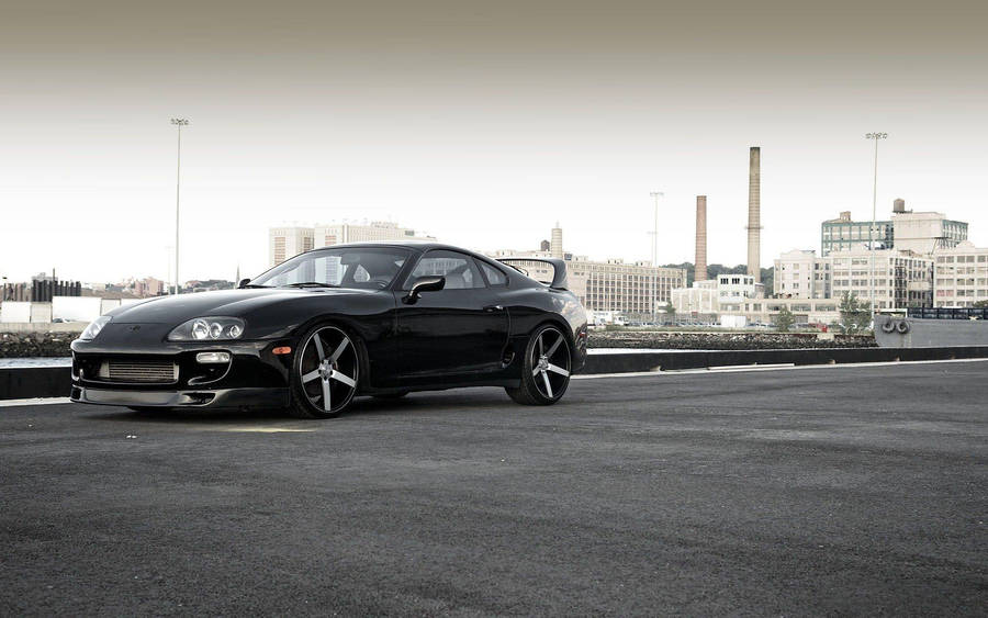 Download 1996 Toyota Supra Mk4 At The Pier Wallpaper | Wallpapers.com