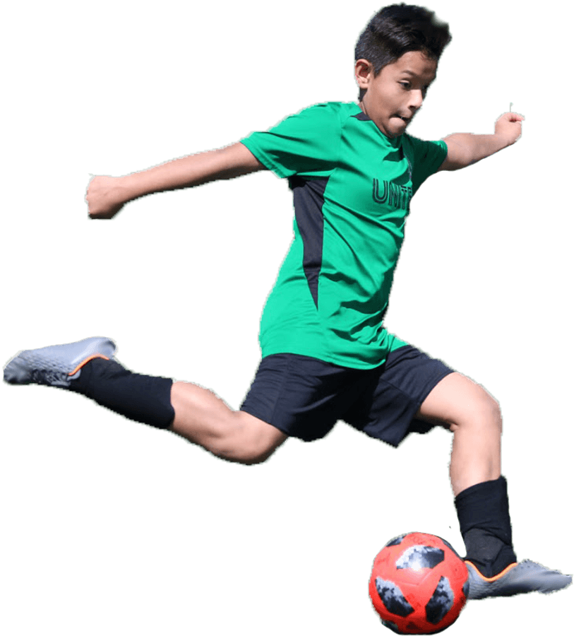 Youth Soccer Player Kicking Ball