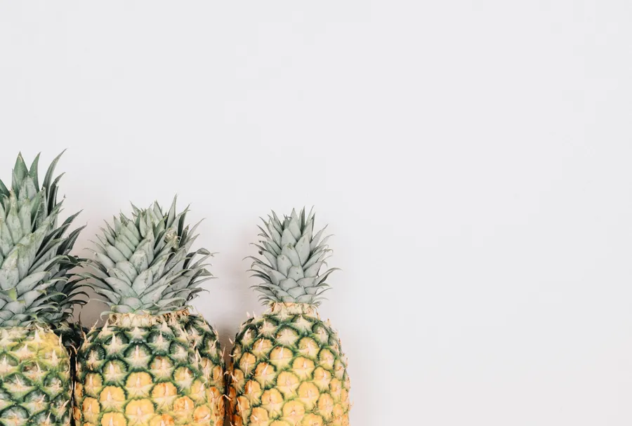 Pineapples on white background wallpaper