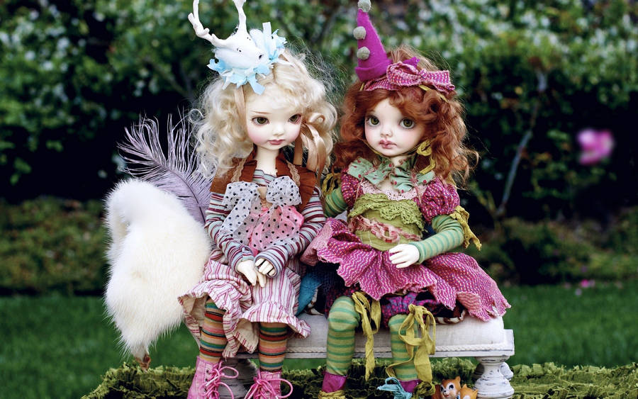 Cute Barbie Doll Pair On Bench