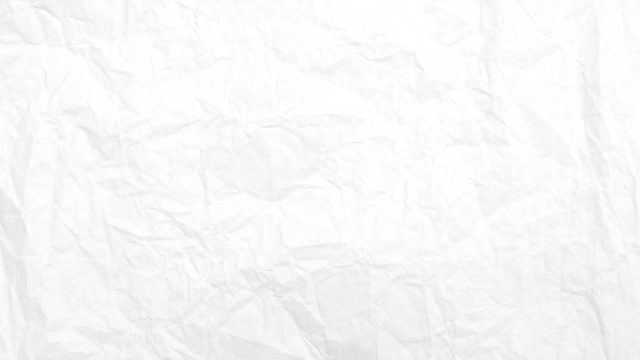 Plain white crumpled paper straightened with visible wrinkles.