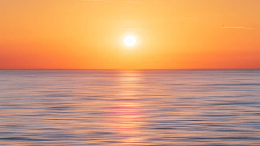 Fundode Oceano com o Pôr do Sol