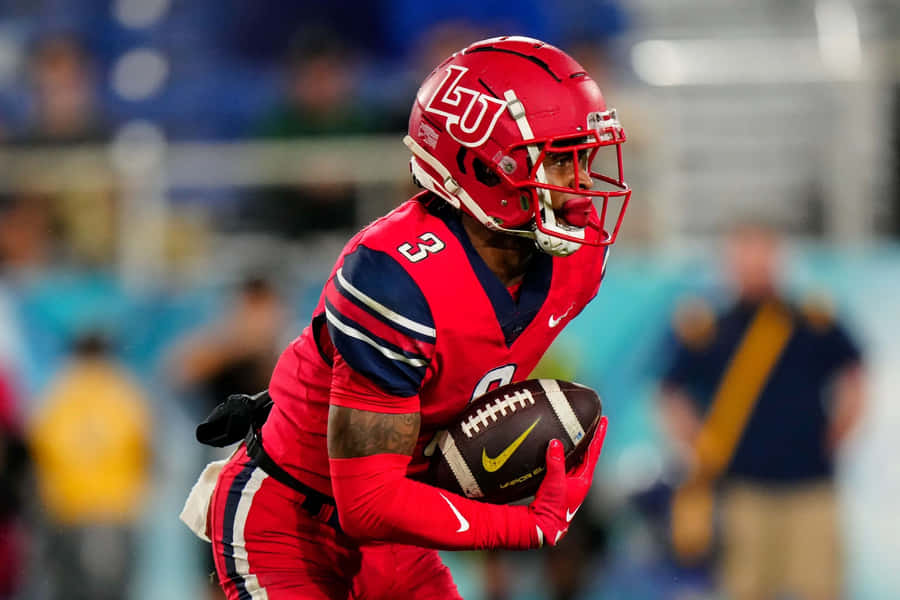 Jogador de Futebol da Liberty University em Ação