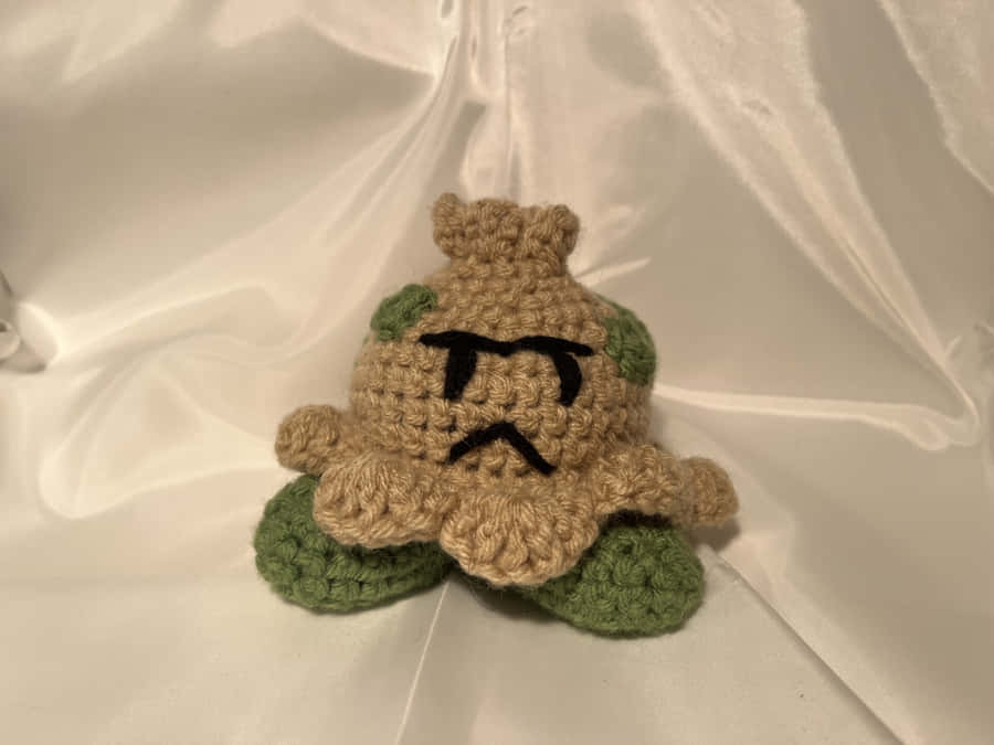 Giocherellarecon il giocattolo di peluche Shroomish fatto a mano e lavorato a maglia.
