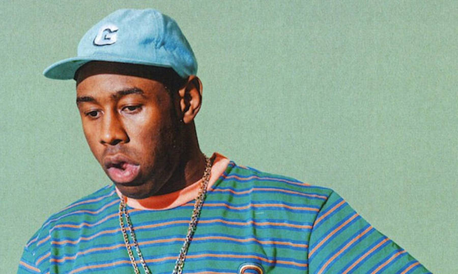 Download 90s Rapper Tyler On Wacky Face Wallpaper | Wallpapers.com