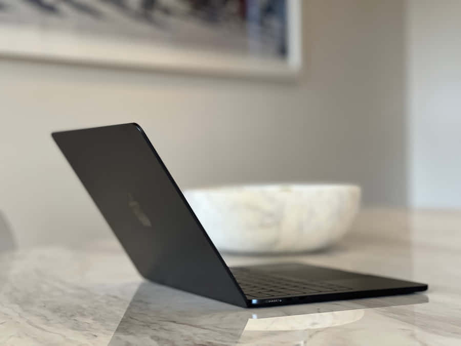 Sofistikeretog stilfuld sort Macbook