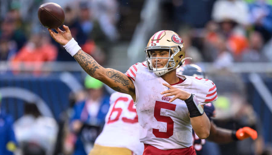 Quarterback wirft Football Aktion
