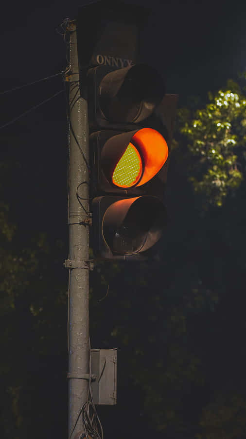 Yellow Traffic Light In Gray Post
