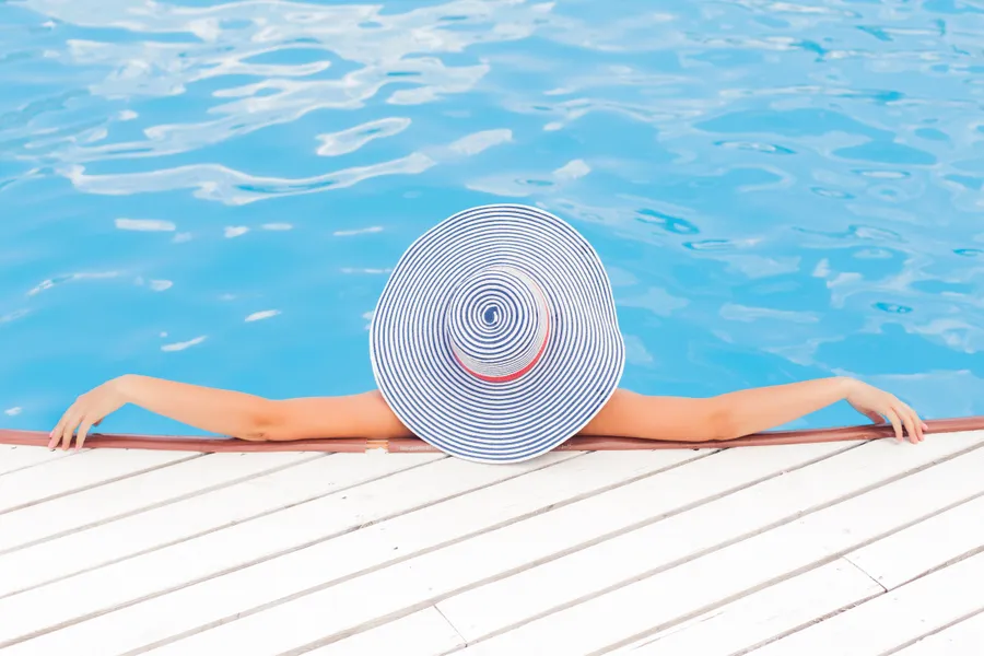 Pool shot of a woman in summer wallpaper.