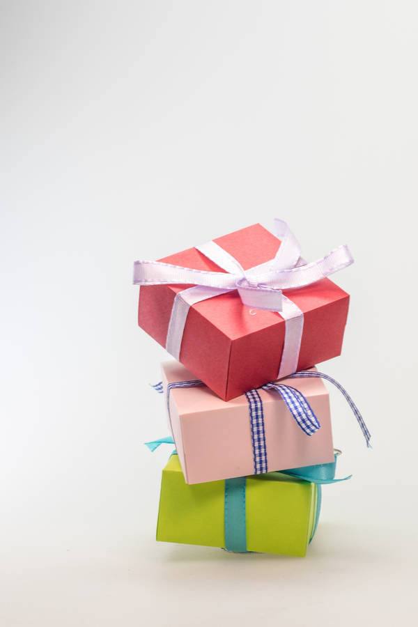 Download Birthday Stacked Colorful Gift Boxes Wallpaper | Wallpapers.com