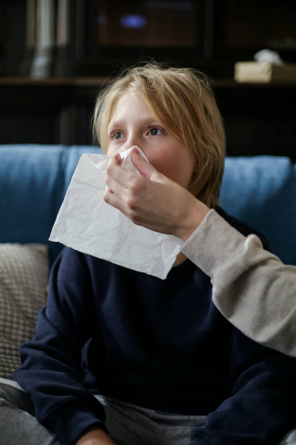 Download Boy Sneeze Onto A Napkin Wallpaper | Wallpapers.com