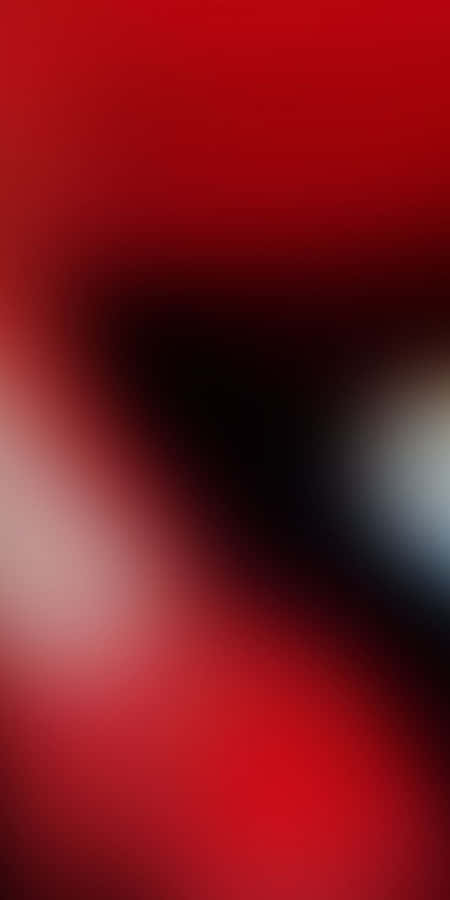 Muestratu personalidad audaz con un fondo de pantalla de degradado rojo.