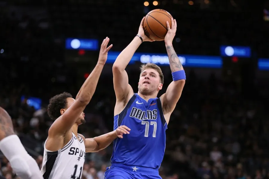 Luka Doncic Mid-Action Shoot wallpaper.