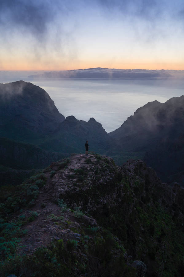 Free Person Standing on Top of Mountain Stock Photo