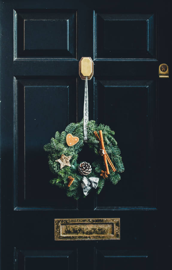 Download Christmas Wreath On Door Wallpaper | Wallpapers.com