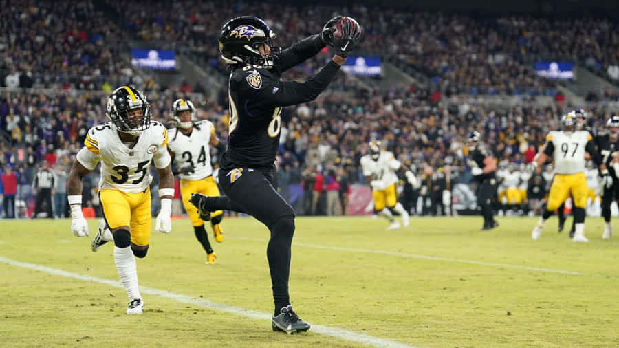 Ação de Captura de Futebol Ravens vs Steelers
