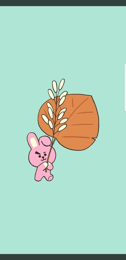 Download Cooky Bt21 Holding A Leaf Wallpaper | Wallpapers.com