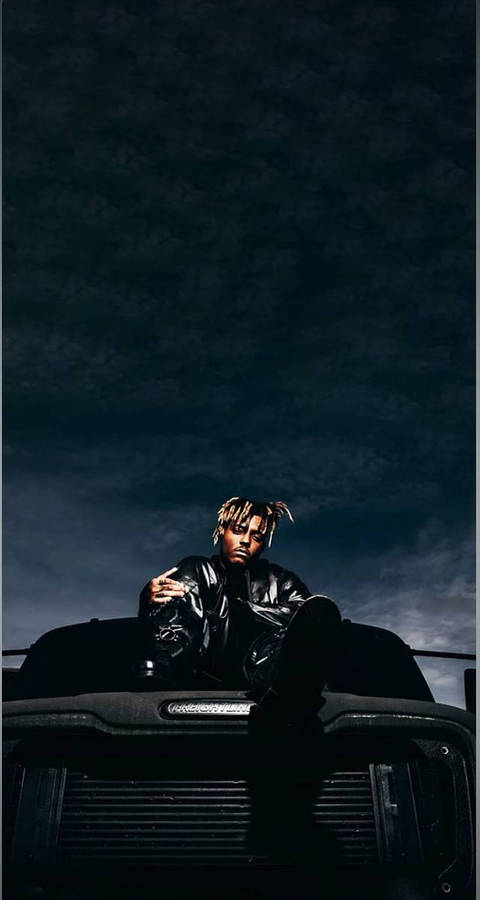 Download Cool Juice Wrld On A Vehicle’s Hood Wallpaper | Wallpapers.com