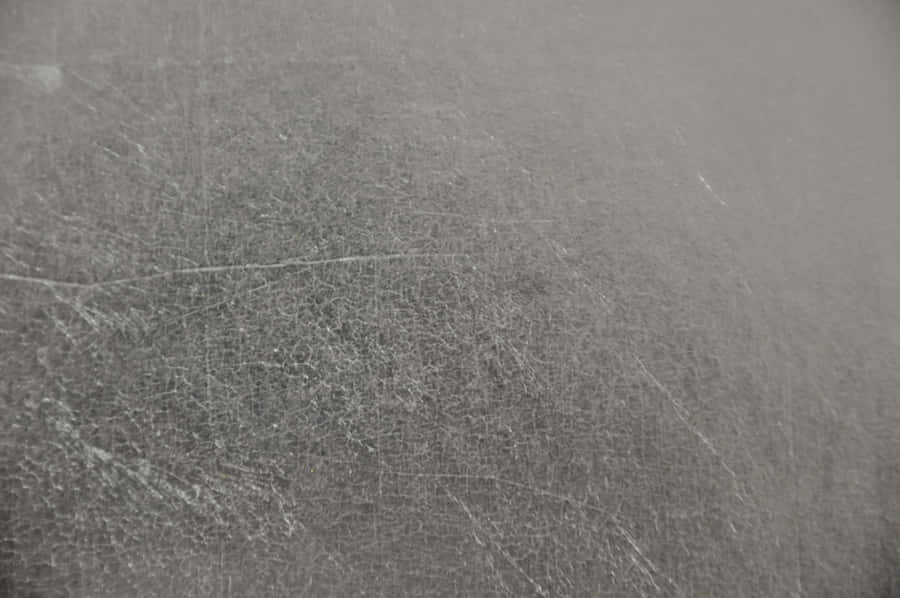 Einabstrakter Hintergrund aus silbernem Folienmuster.