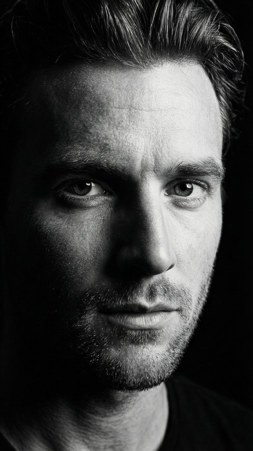 A dramatic black and white studio portrait of Tiarnie Coupland