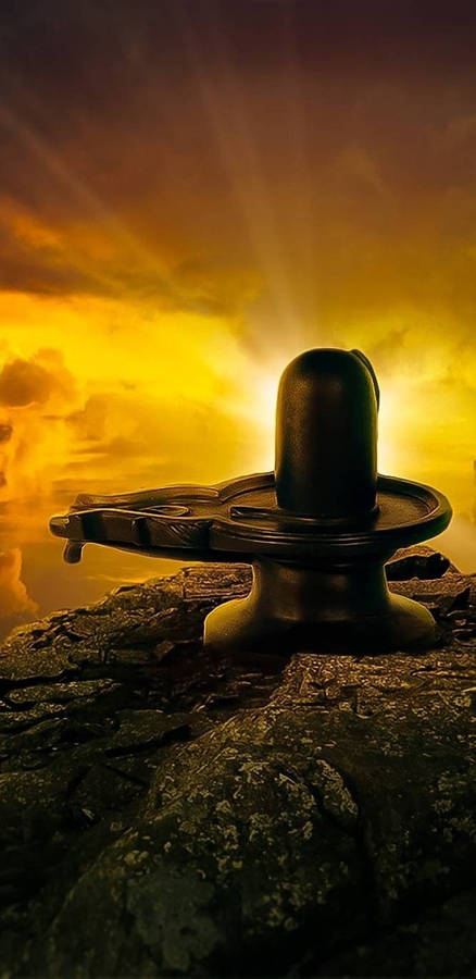 "DevotionalStone Shiva Lingam" would translate to "Andligsten Shiva Lingam" in Swedish. However, this phrase doesn't necessarily relate to computer or mobile wallpaper. If you're looking to describe a wallpaper image featuring the Shiva Lingam, you could say "Bakgrundsbild med Shiva Lingam".