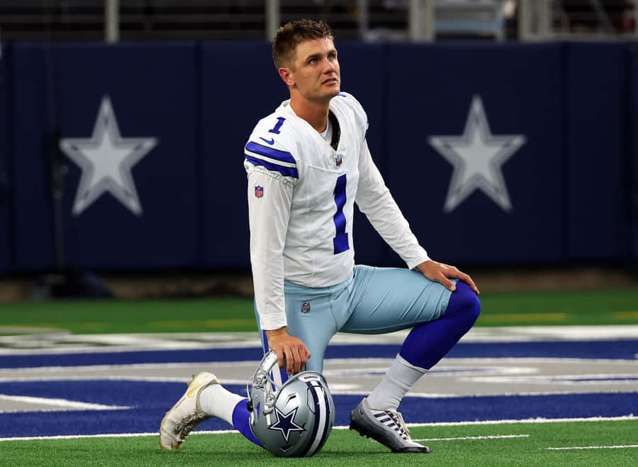 Fußballspieler kniet im Dallas Stadion