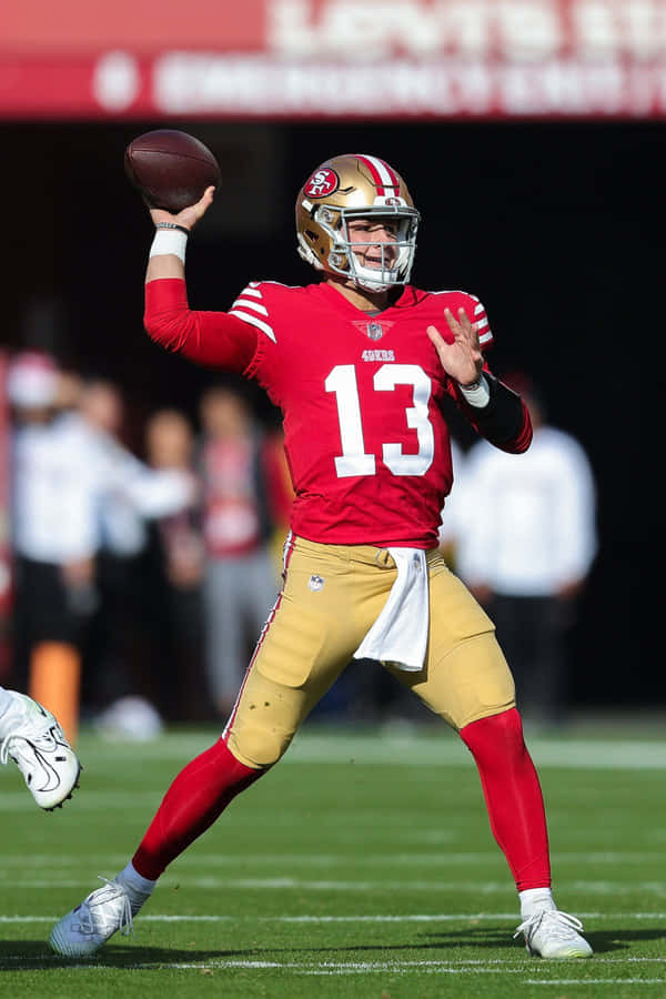 Quarterback in Posizione di Azione Uniforme Rossa