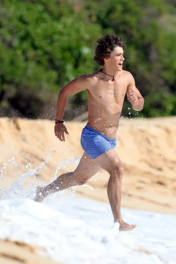Uomo che Corre sulla Spiaggia