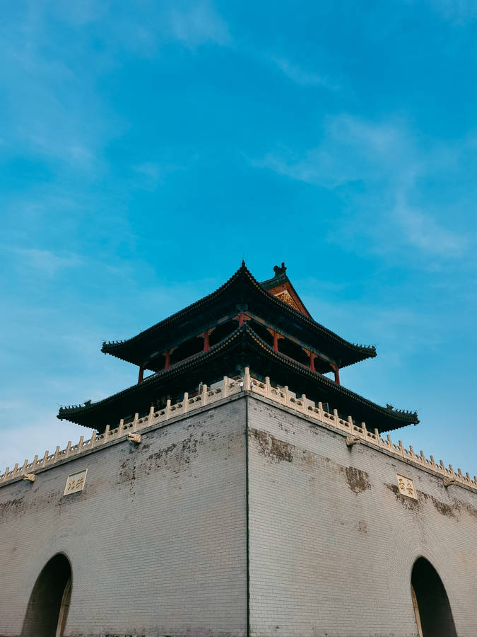 white and black concrete building under blue sky during daytime