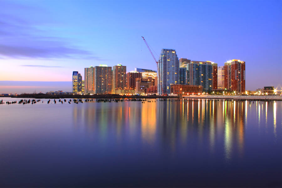 Preview wallpaper usa, jersey city, new jersey, port, purple, night, pink, sunset, sky, clouds, skyscrapers, lights, river, hudson, reflection, hdr