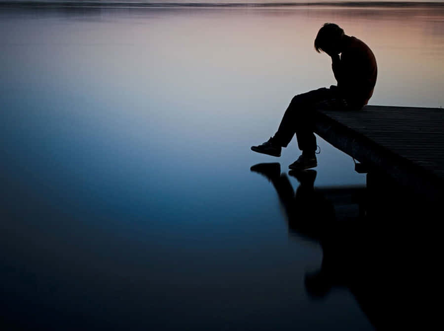 Imagemde Pessoa Triste em um Lago