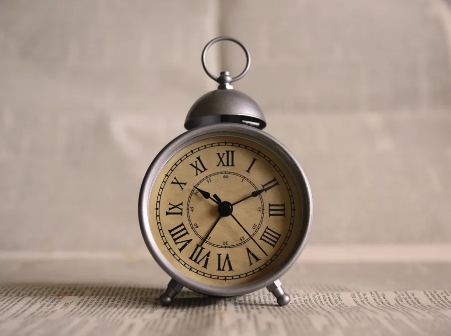 Silver clock with Roman numbers wallpaper