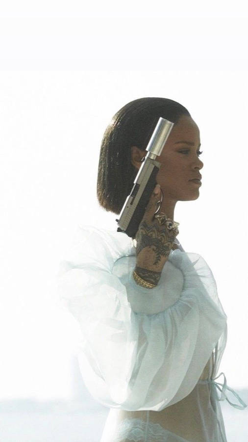 Download Fenty Rihanna Holding A Gun Wallpaper | Wallpapers.com