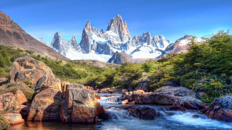 Mount Fitz Roy view over rock mountain and stream wallpaper