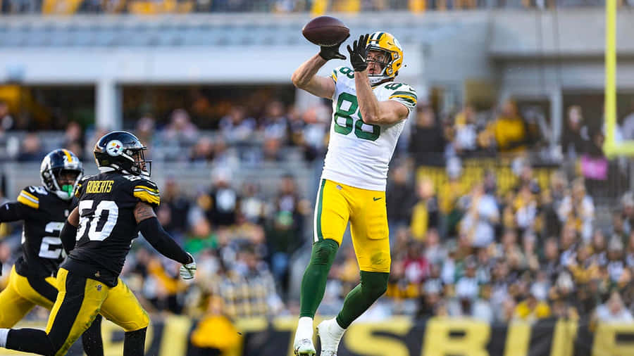 Jogador dos Packers Pegando Futebol