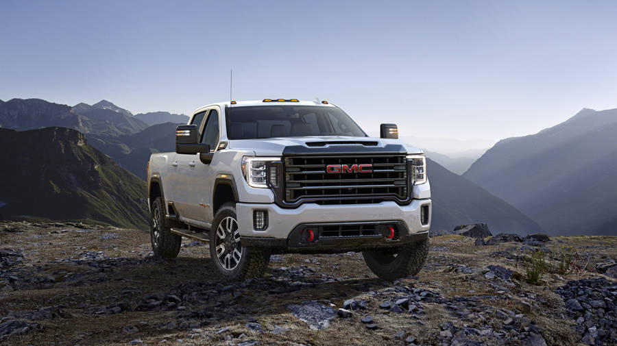 Download Gmc On A Rocky Mountain Wallpaper | Wallpapers.com