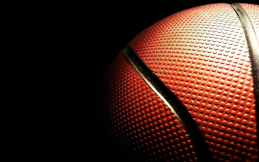 Download Half Basketball Ball Close Up Wallpaper | Wallpapers.com