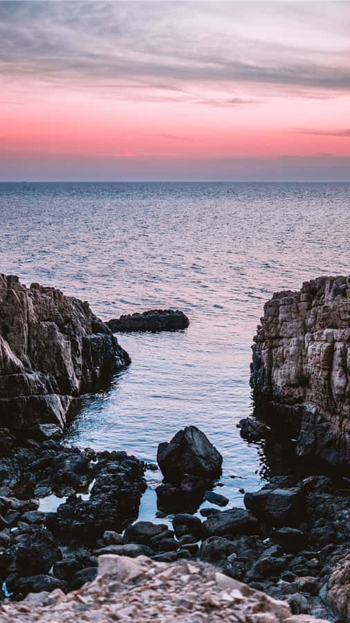 Cliffs ao Pôr do Sol à Beira do Mar.jpg