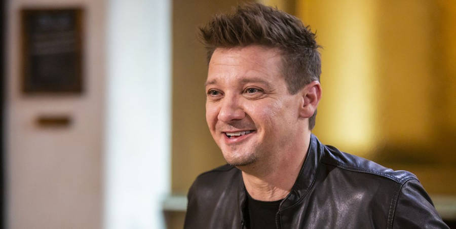 Download Jeremy Renner On Interview Wallpaper | Wallpapers.com