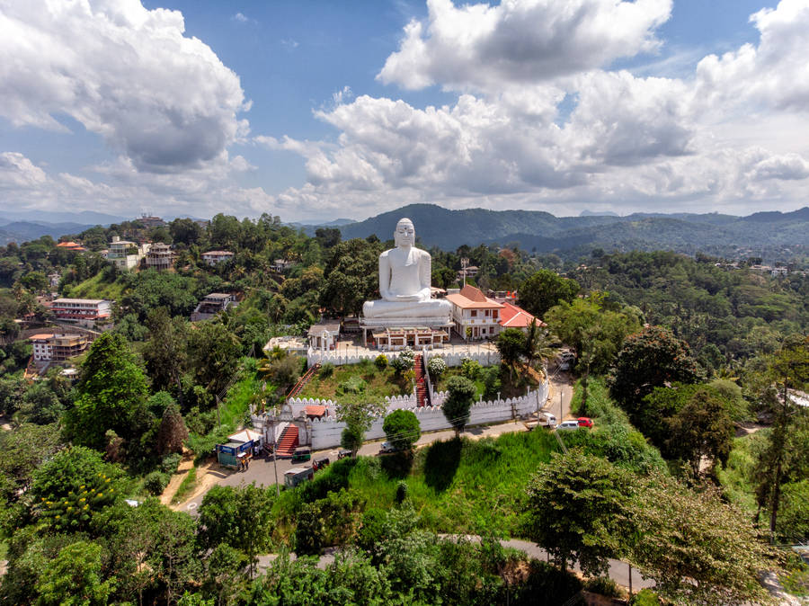 Gautama Buddha statue under white clouds
