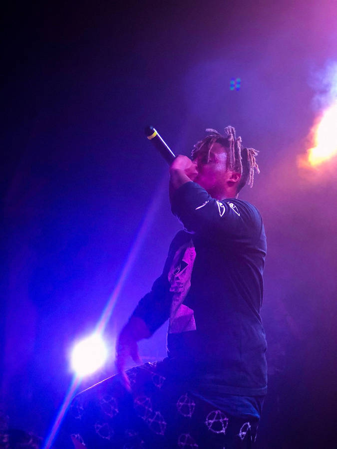 Download Juice Wrld Performing On Stage Wallpaper | Wallpapers.com