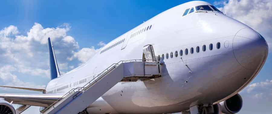 Overskyethimmel 3440x1440p Jumbo Jet baggrund