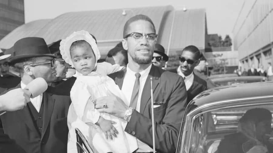 Malcolm X mit Kind