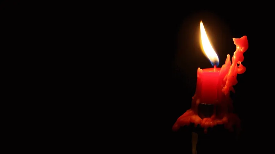 Burning red candle wallpaper