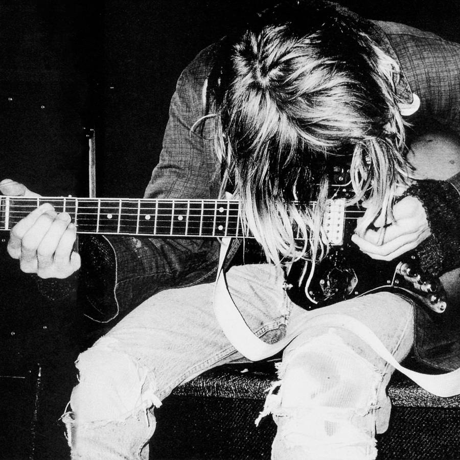 Download Kurt Cobain Over Guitar Wallpaper | Wallpapers.com