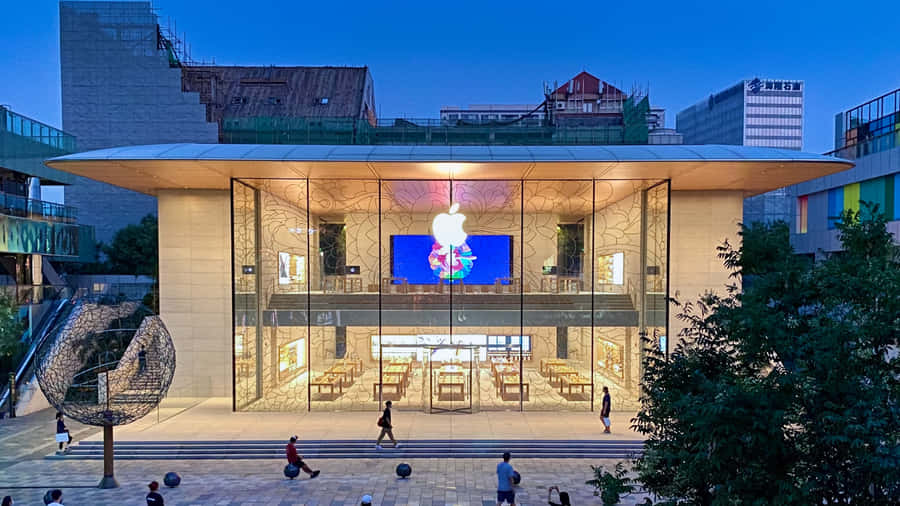 Fachada Moderna da Apple Store ao Anoitecer